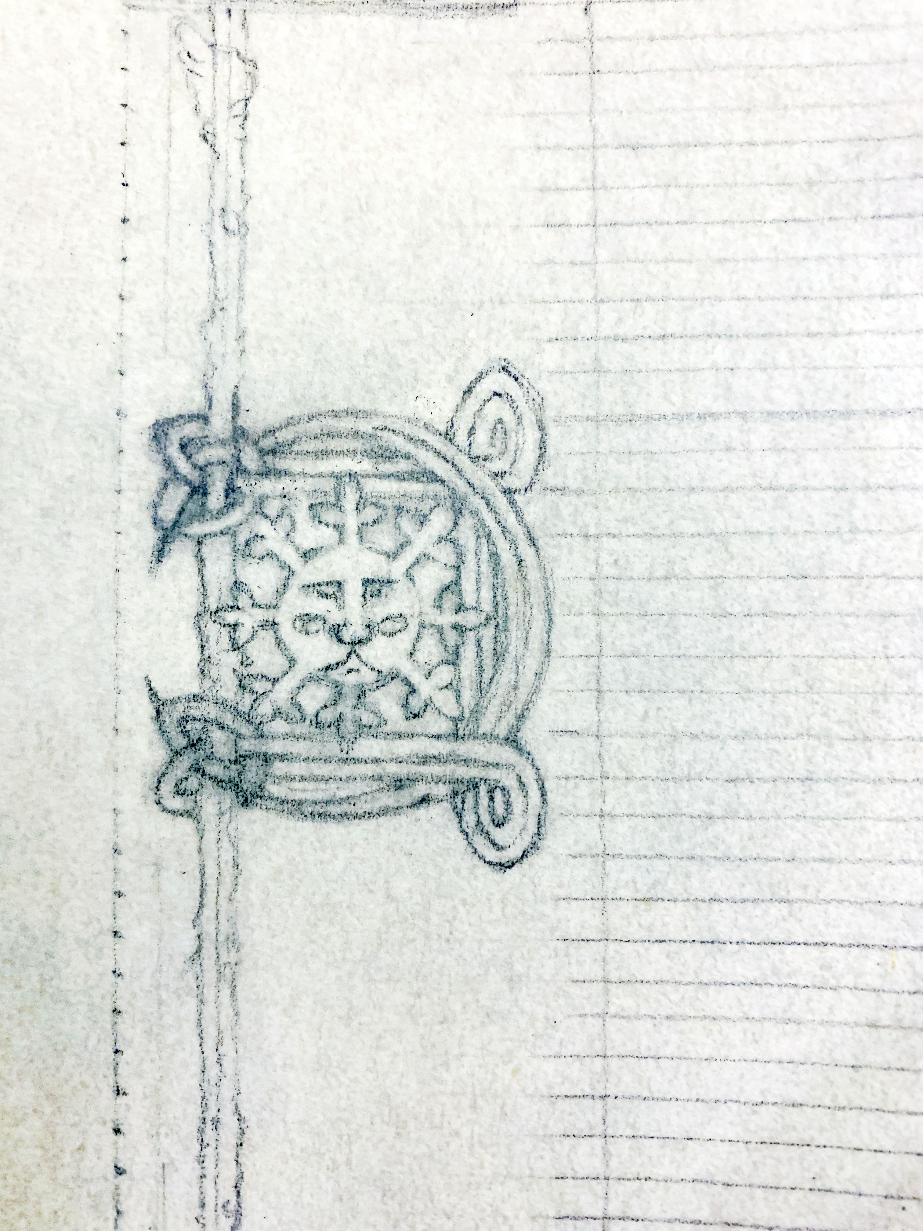 A medieval scroll award in progress: the pencil stage, close-up of the green-man's face encompassed in a crescent moon with celtic knot details bordering it